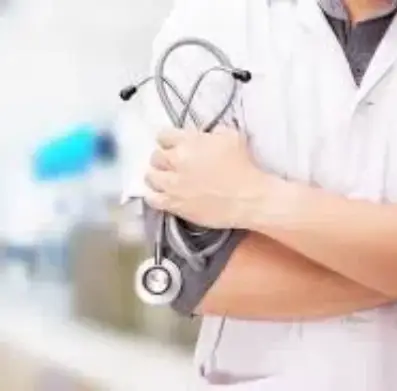 A doctor holding his arm with a stethoscope.